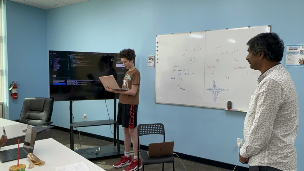 Students participating in Python summer camp activities at Y2L Academy.